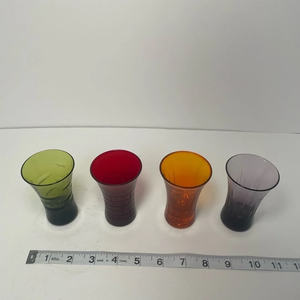 Vintage patterned multicolored shooter glasses.